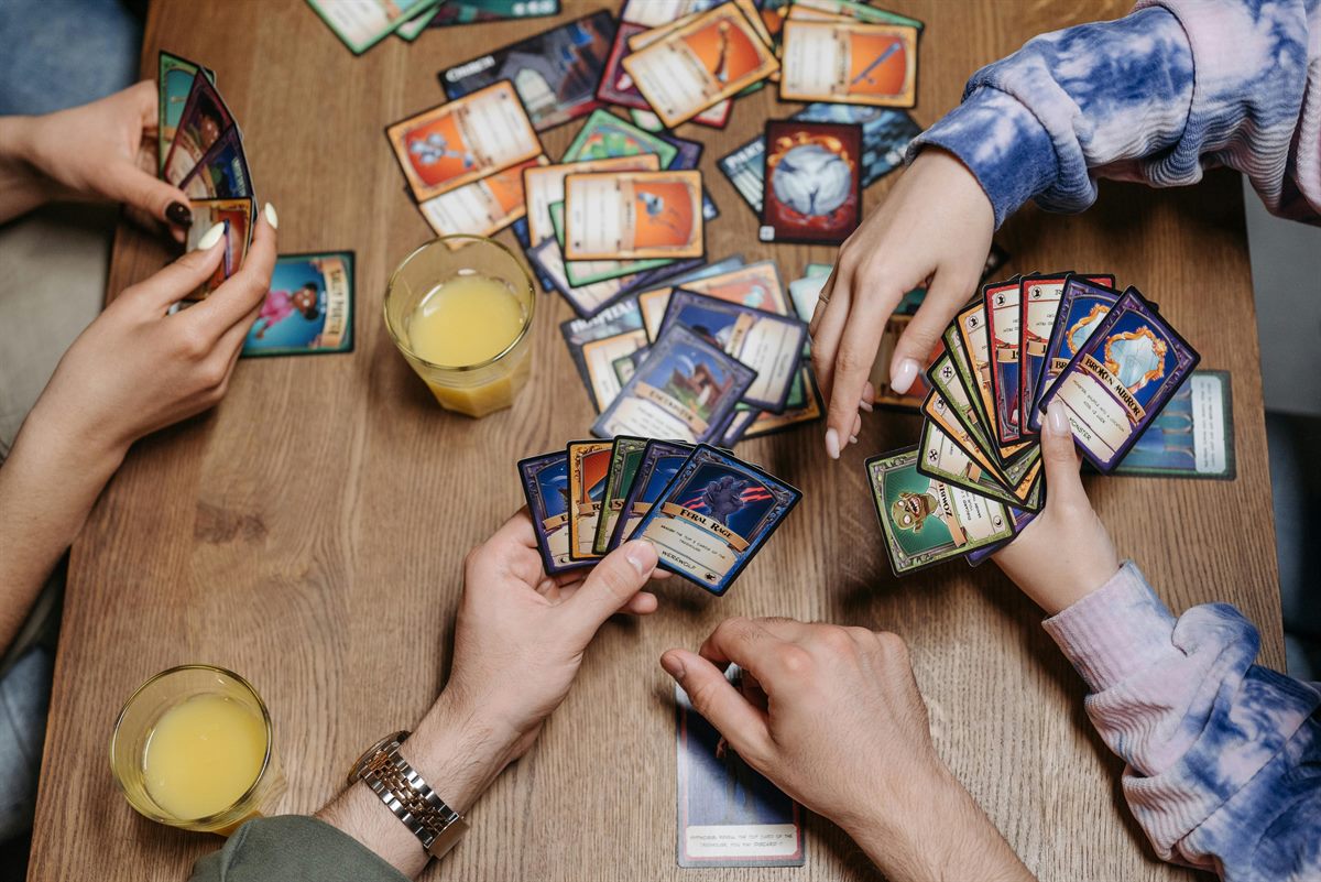 Kids excited and trading their new cards at the kitchen table